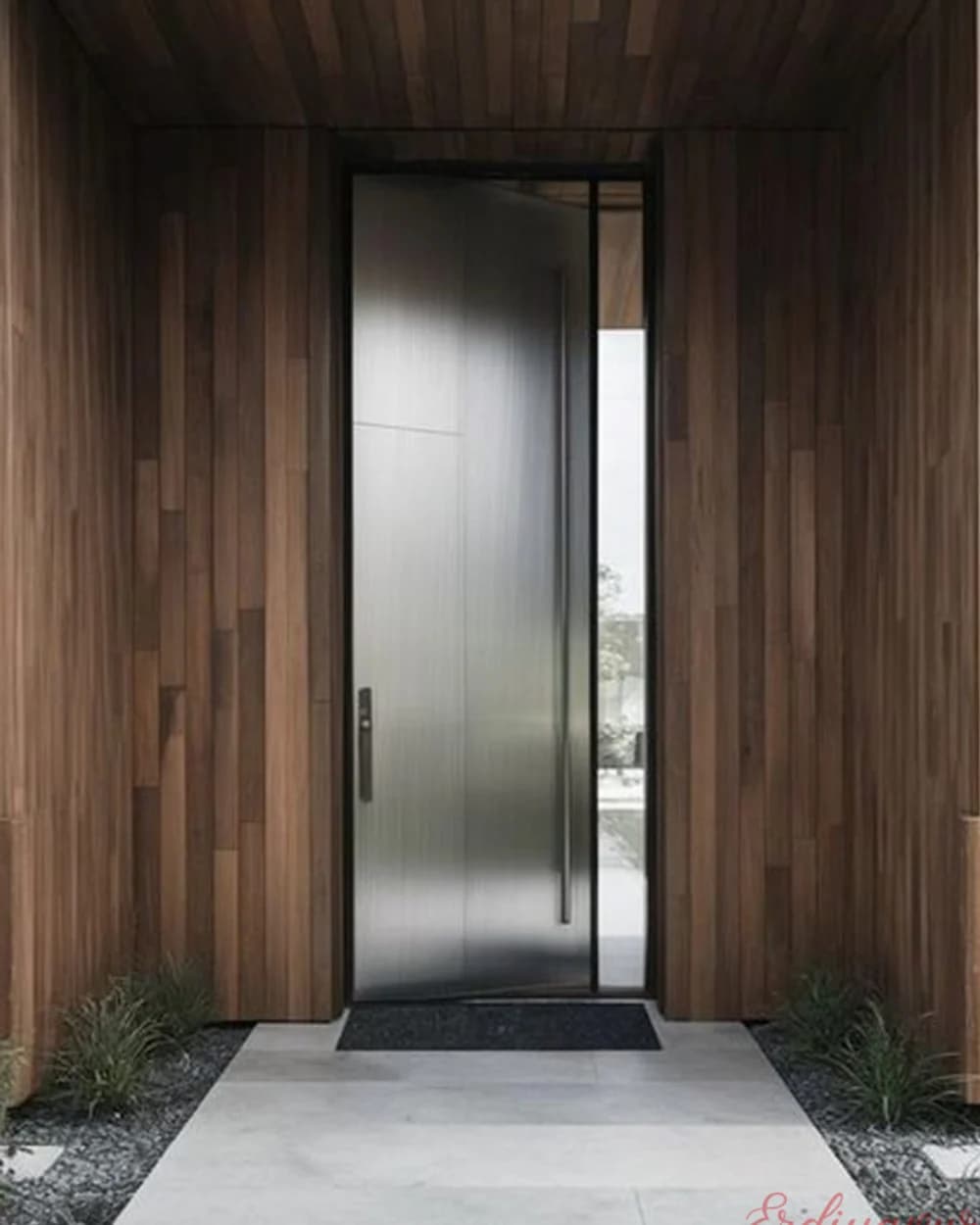 Chrome-Clad Pivot Door on a Wood Facade — product code BY-272