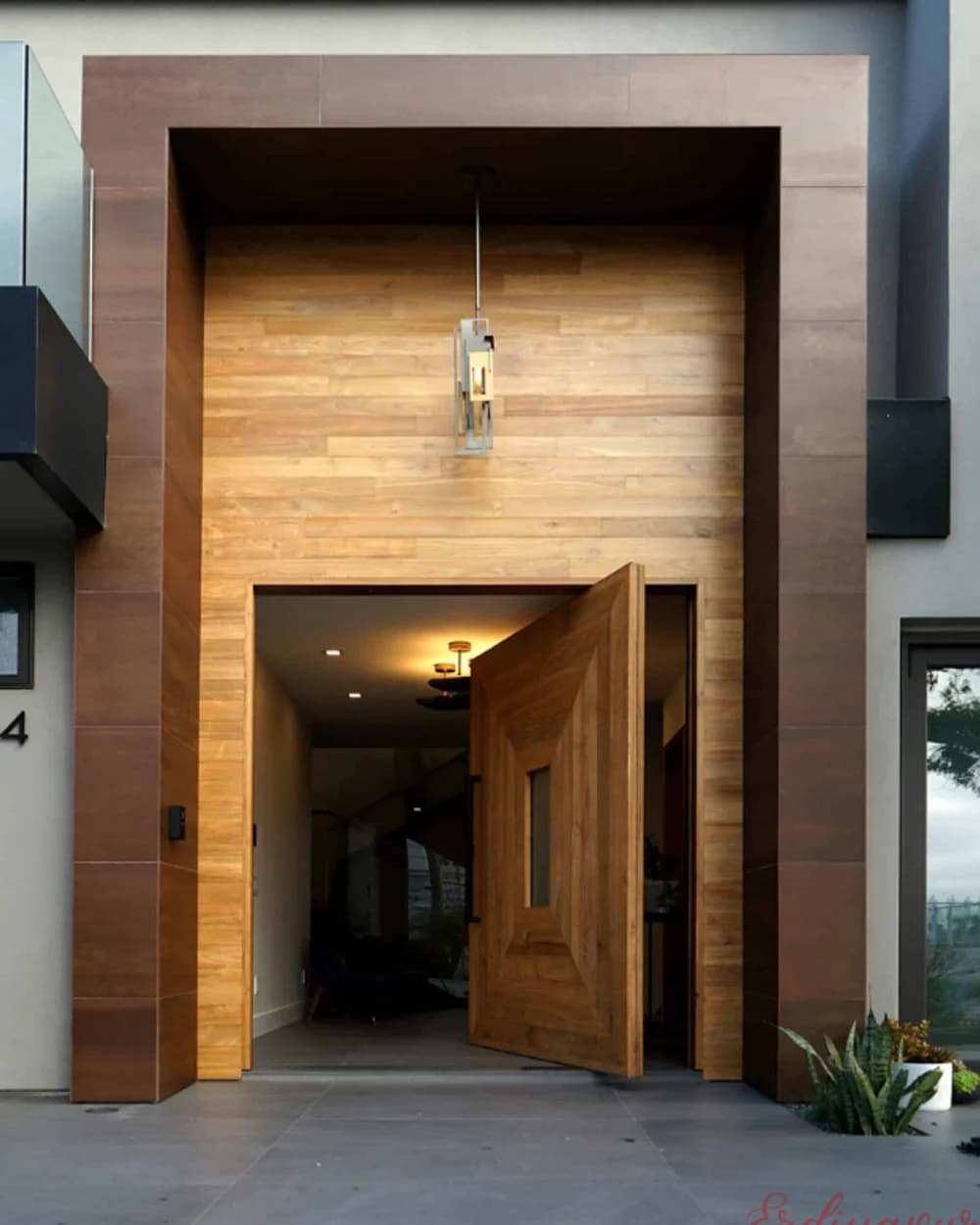 Honey-Toned Pivot Door Flush with a Wood Facade — product code BY-16