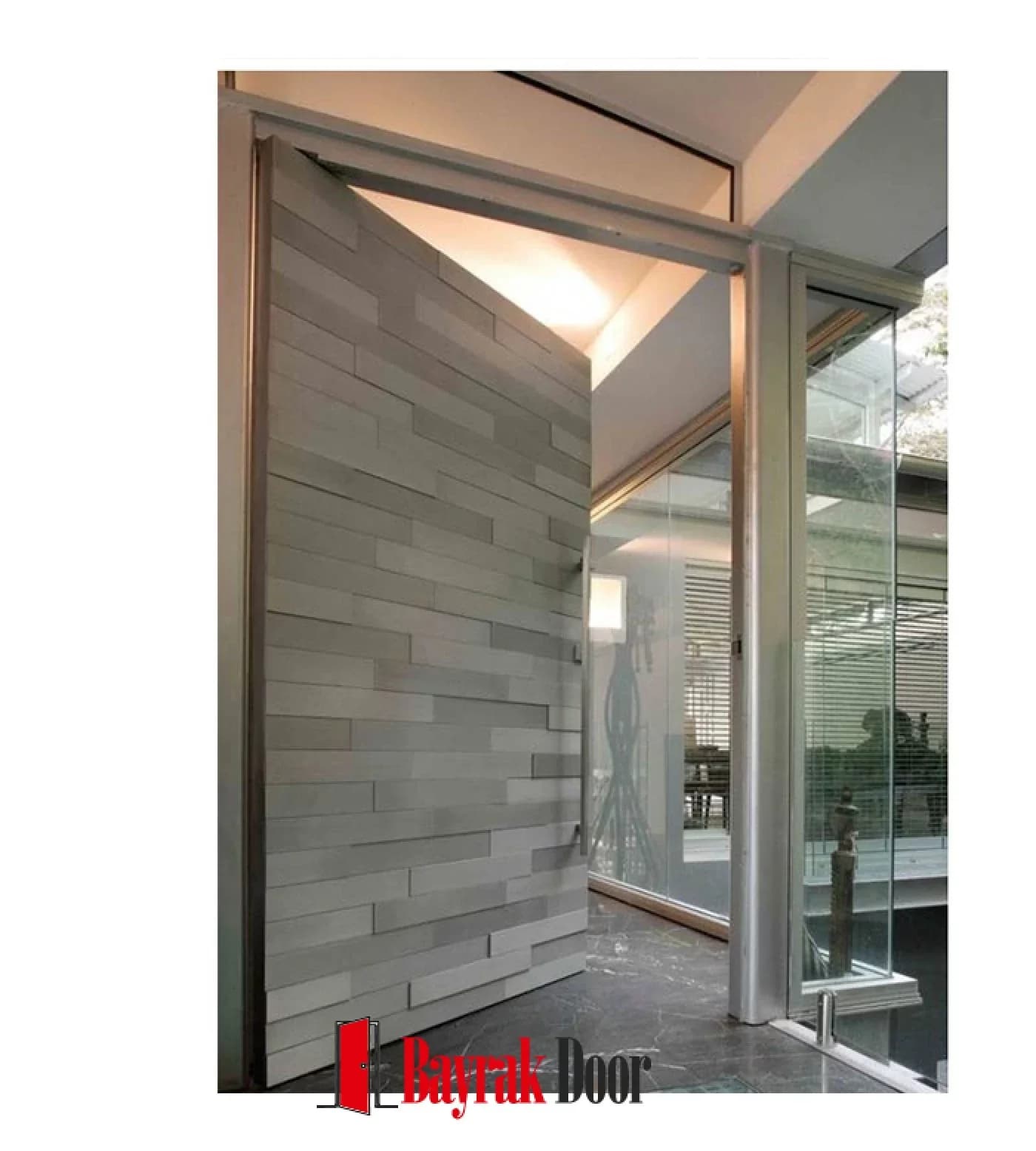 Horizontal Strip Grey Stone-Textured Pivot Steel Door TR323 — Pivot leaf in grey stone-textured horizontal strip cladding, with a recessed handle at a glazed entrance.