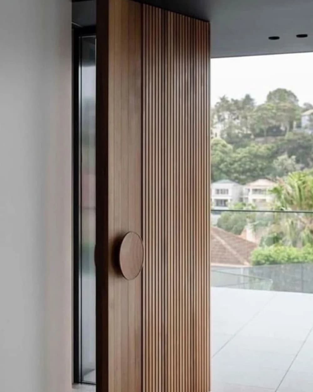 Light Wood Pivot Door with Vertical Slats and Round Handle — product code BY-128